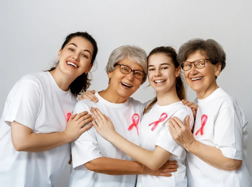 Cleaning for a Reason community support with women wearing pink cancer awareness ribbons